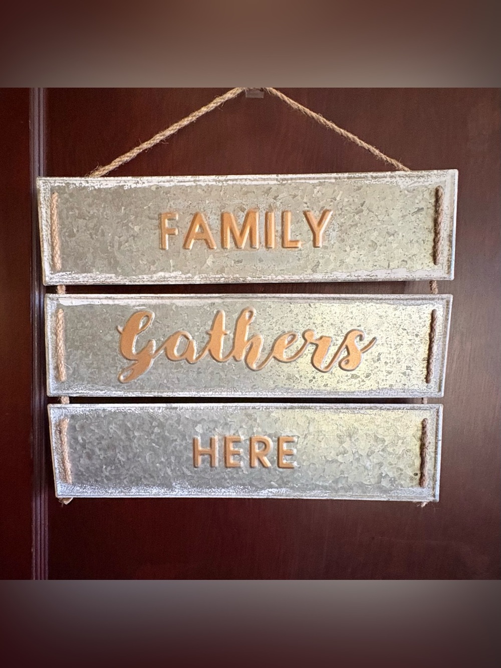 Family Gathers Here Wall Sign - Metallic Silver with Gold Lettering